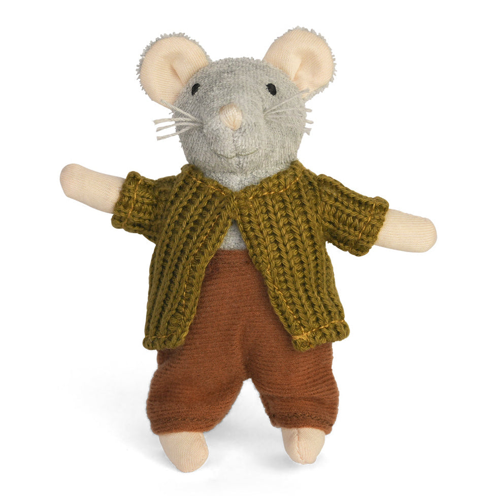 Stuffed toy mouse wearing a knitted sweater and pants on a white background