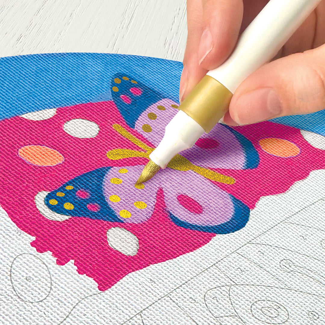 A person using the golden marker to fill in the canvas 